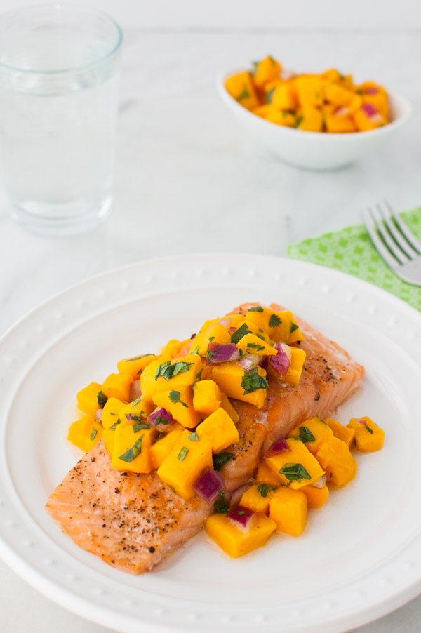 Roasted Salmon with Mango Salsa - Oven roasted salmon topped with a bright, sweet, and spicy mango salsa. | stg-tamingofthespooncom-staging.kinsta.cloud