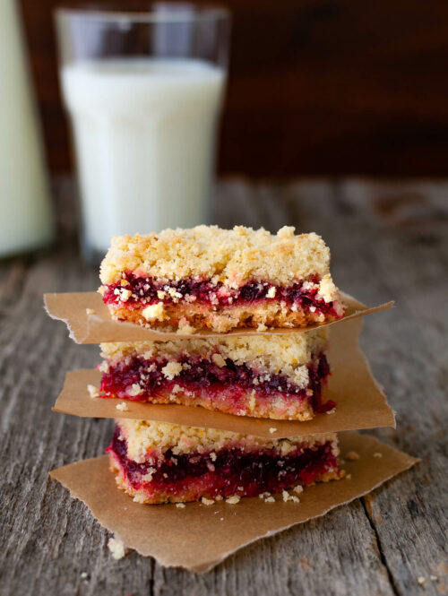 A stack of three cranberry orange crumb bars.