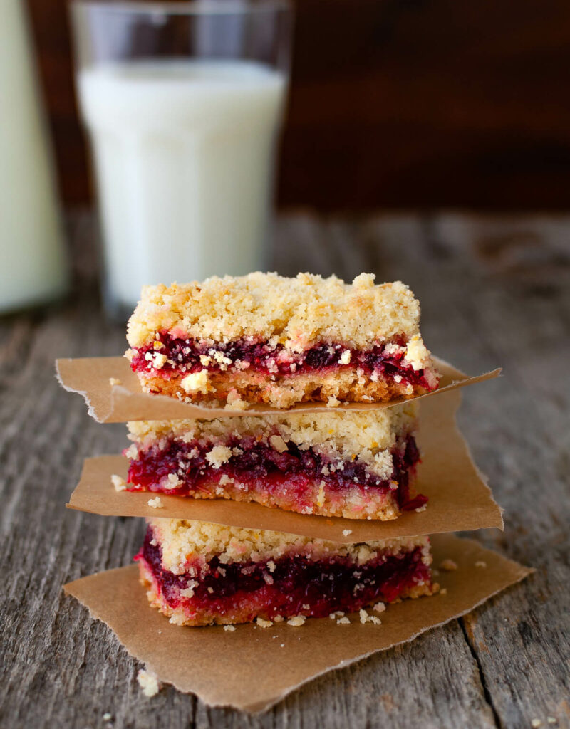 A stack of three cranberry orange crumb bars.