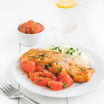 Fillet of roasted salmon served with some grapefruit salsa.