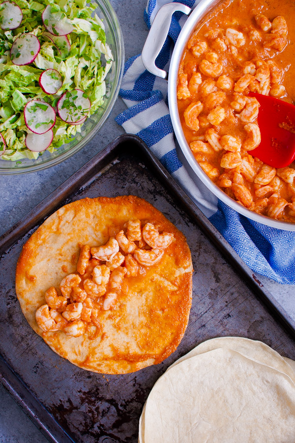 Shrimp and chipotle sauce on a tortilla.