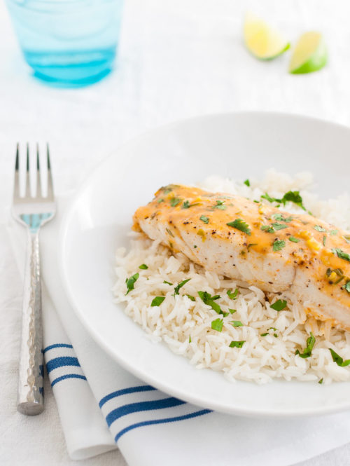 Plate of mahi-mahi with Thai coconut curry sauce and steamed rice.