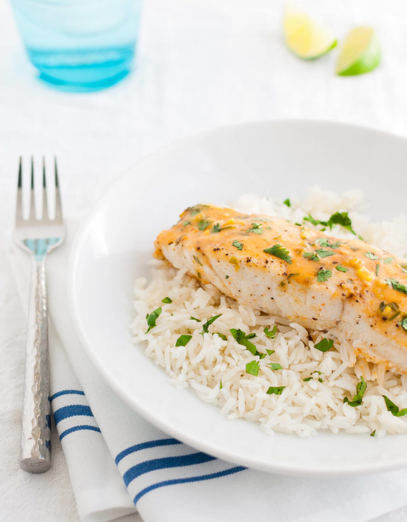 Plate of mahi-mahi with Thai coconut curry sauce and steamed rice.