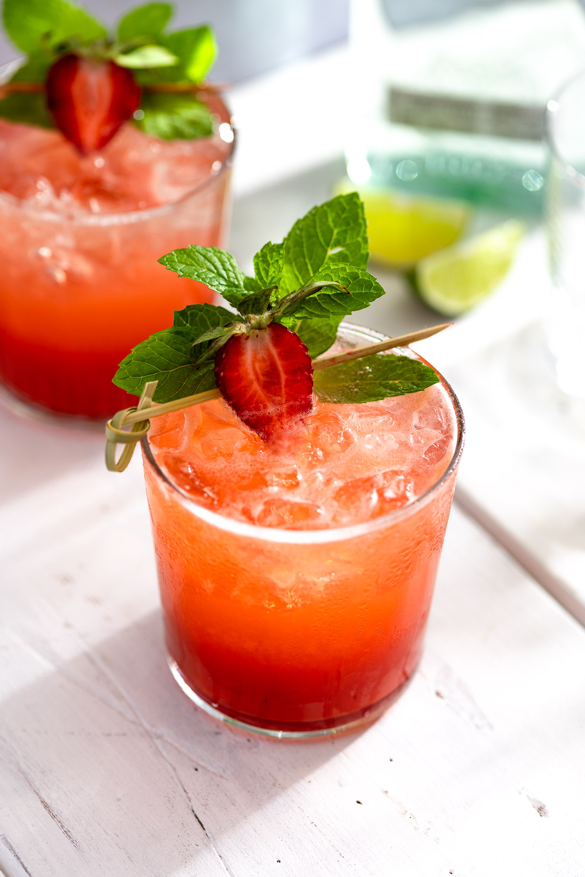 Close-up of two glasses of strawberry mojito.