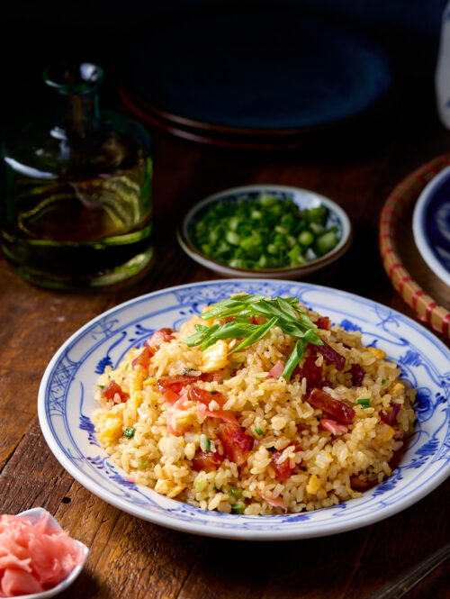Fried rice on a blue and white plate.