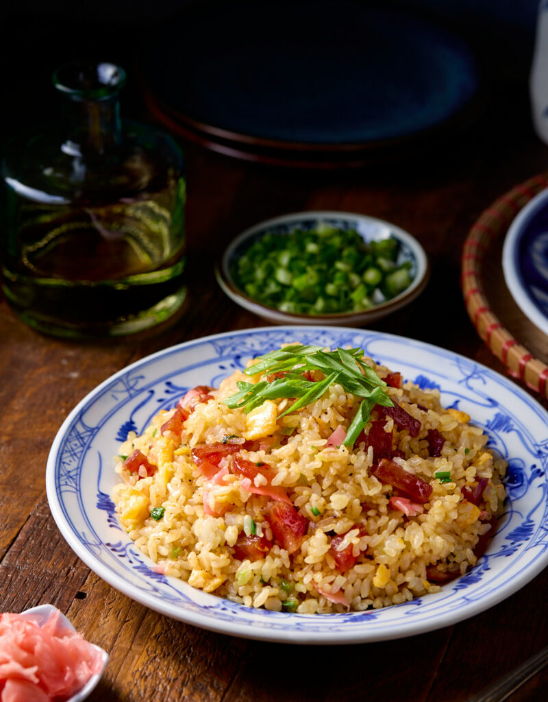 Fried rice on a blue and white plate.
