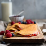 Cottage cheese pancakes spread with strawberry jam.