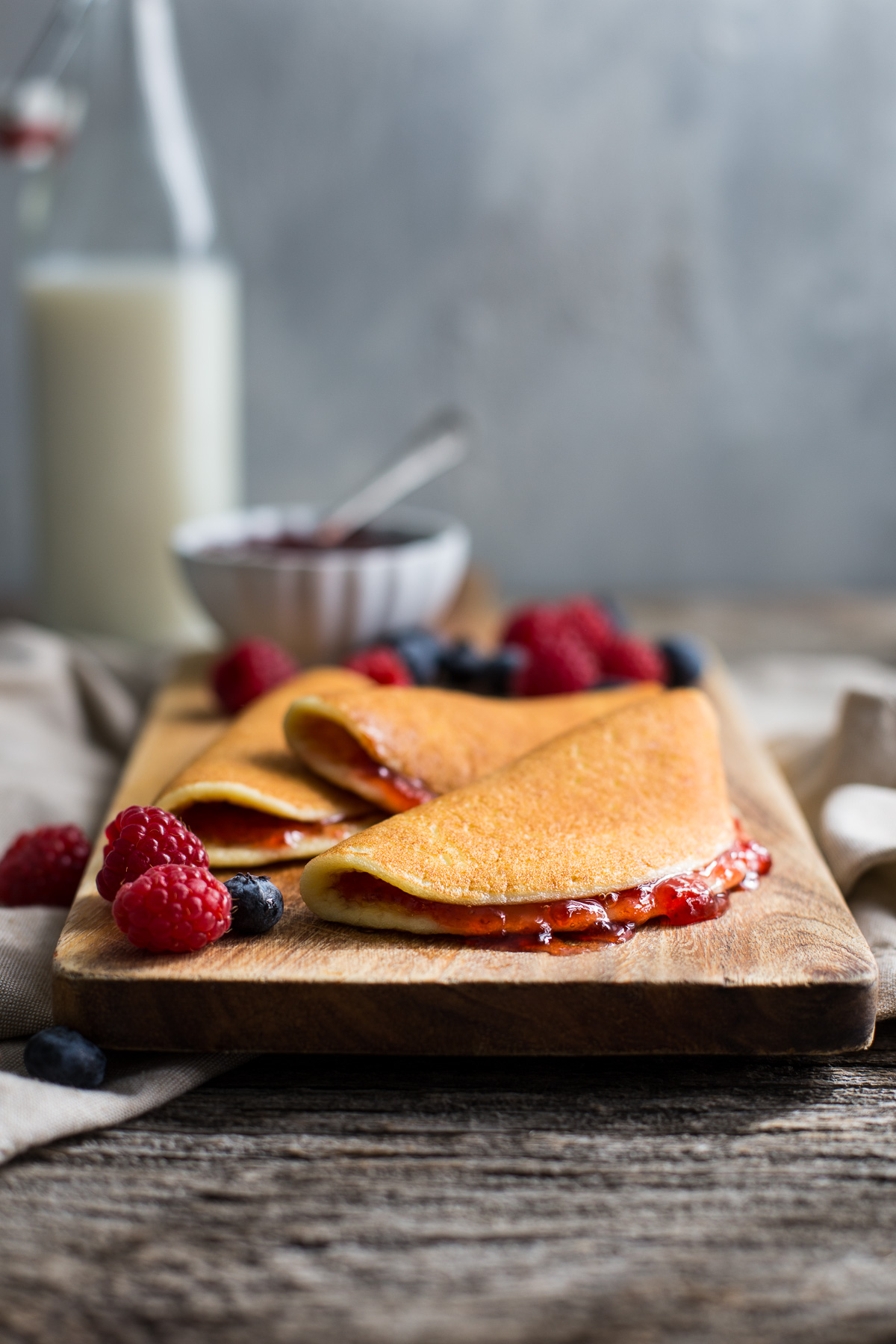 Cottage cheese pancakes spread with strawberry jam.